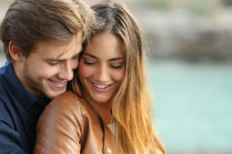 happy couple by the water