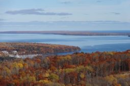 Elevated view of Bayfield peninsula in fall with marina, lake Superior, and the Apostle Islands in the background
