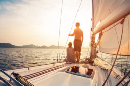 Couple enjoying the sunset on a sail boat
