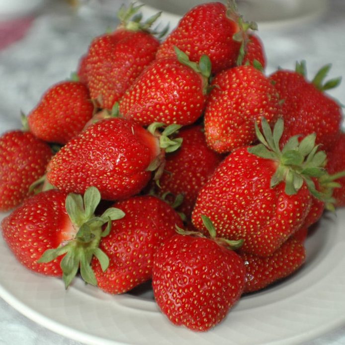Plate of freshly picked strawberries