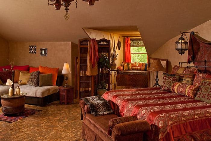 Bed, Window seat, and sitting area in Moroccan Suite