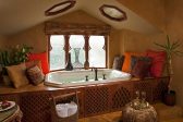 Elevated spa tub in Moroccan Suite