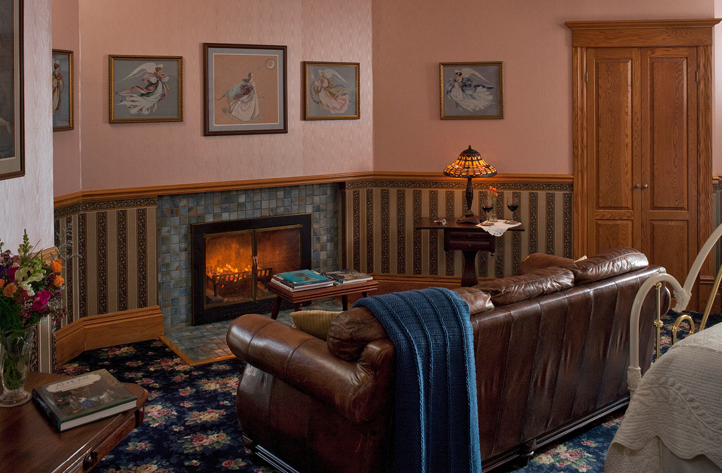 Decorative Fireplace and leather couch in Room VI