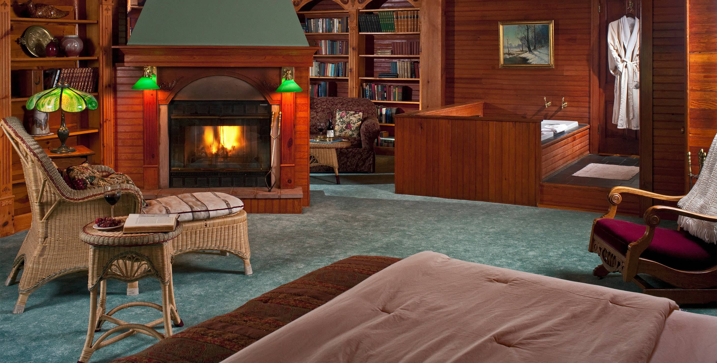 Fireplace and bed in Suite X