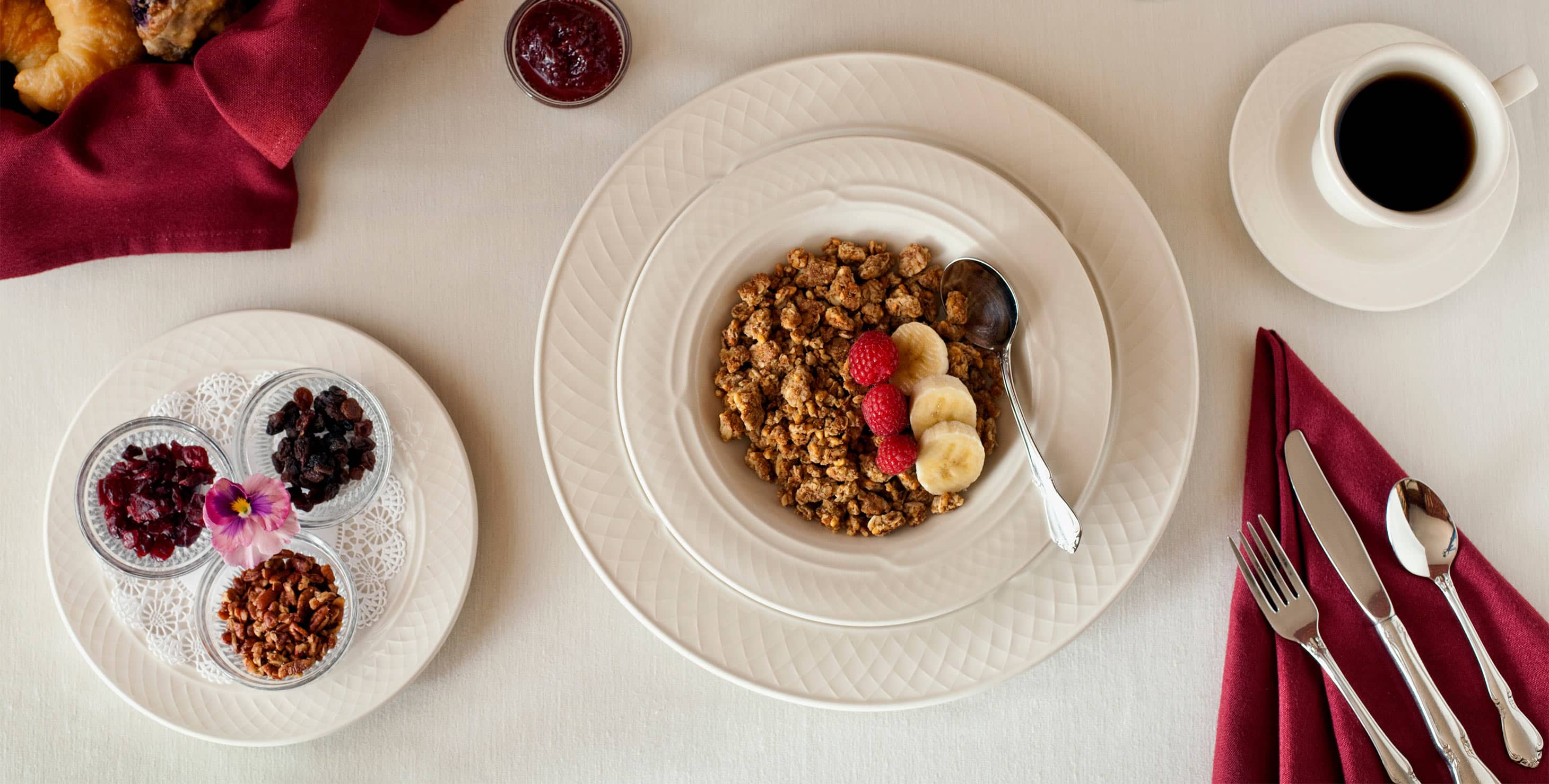 Breakfast table set with Granola bowl in the middle