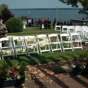 White chairs set up for wedding ceremony