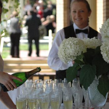 ORI Staff pouring champagne