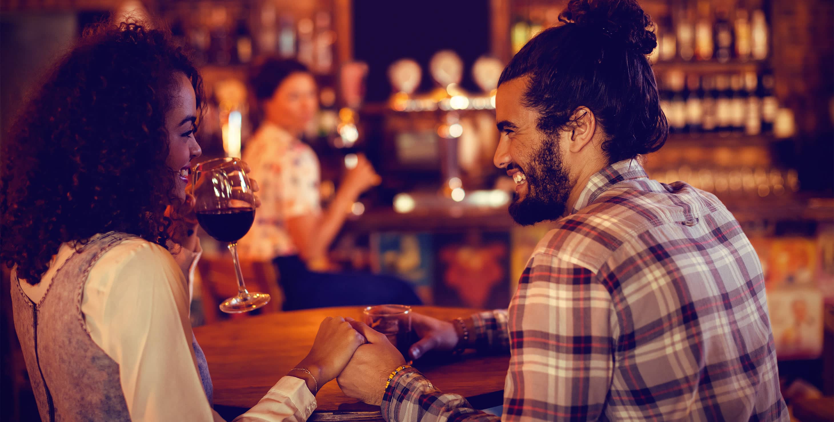 Young couple enjoying drinks in a bar