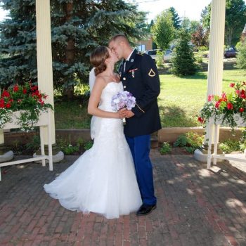 Military Officer kisses his bride