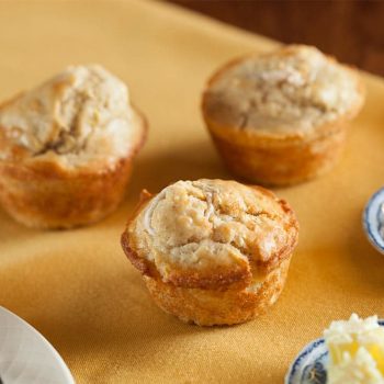 Fresh baked muffins with butter and jam