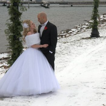 Bride and Groom by the water in winter