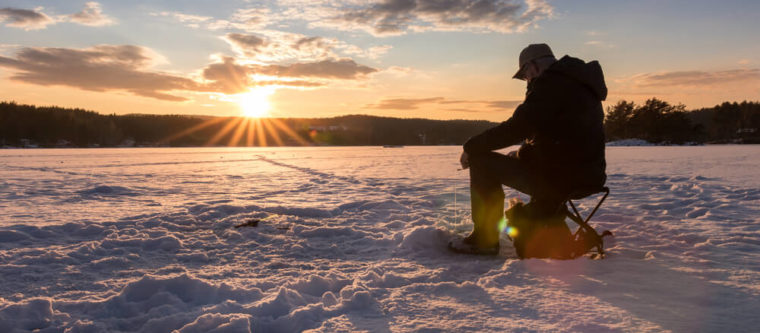 Photo of person on the lake enjoying Wisconsin ice fishing near Bayfield
